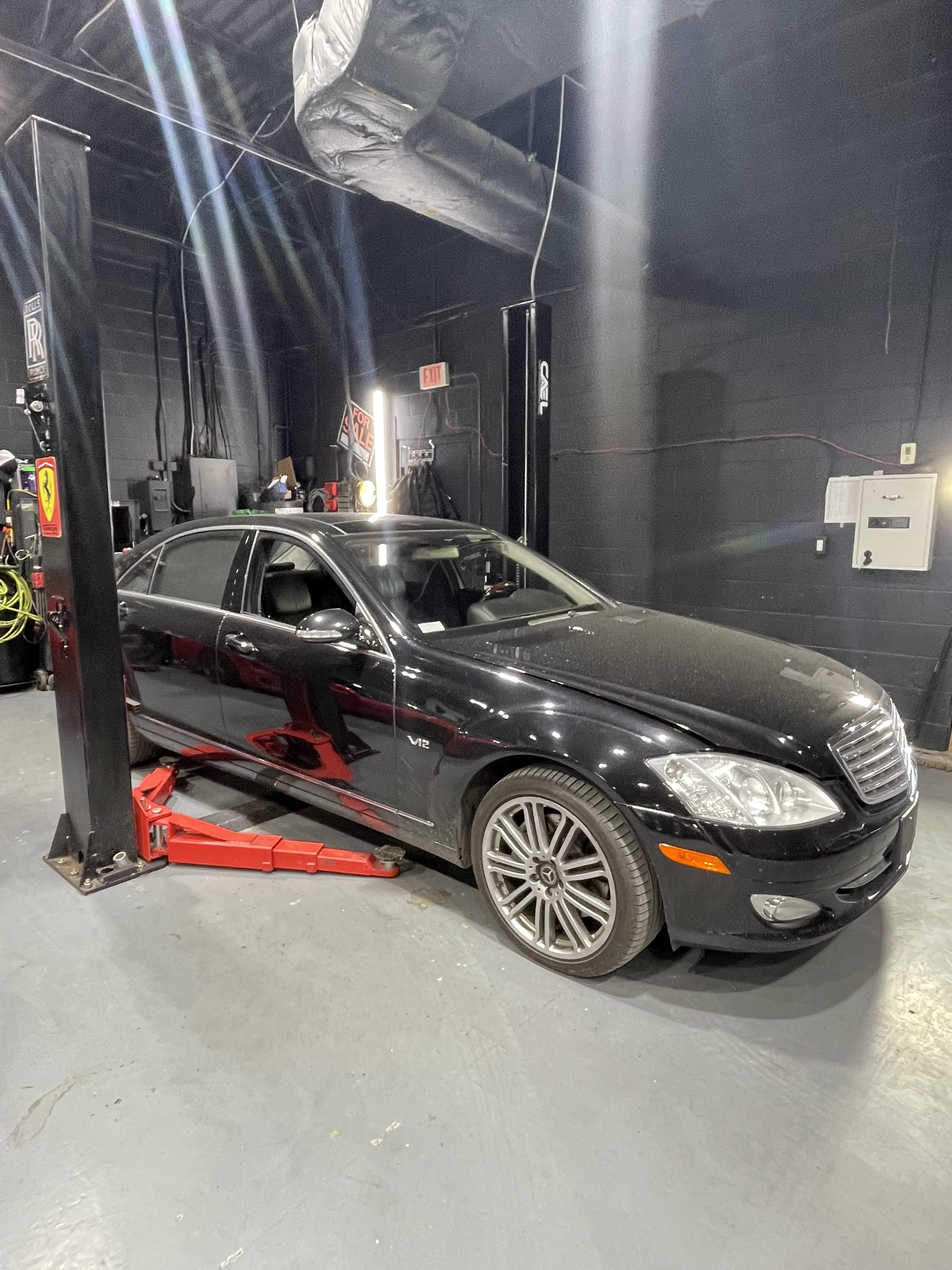 Black Mercedes S600 V12 on lift at Dreamteam Automotive